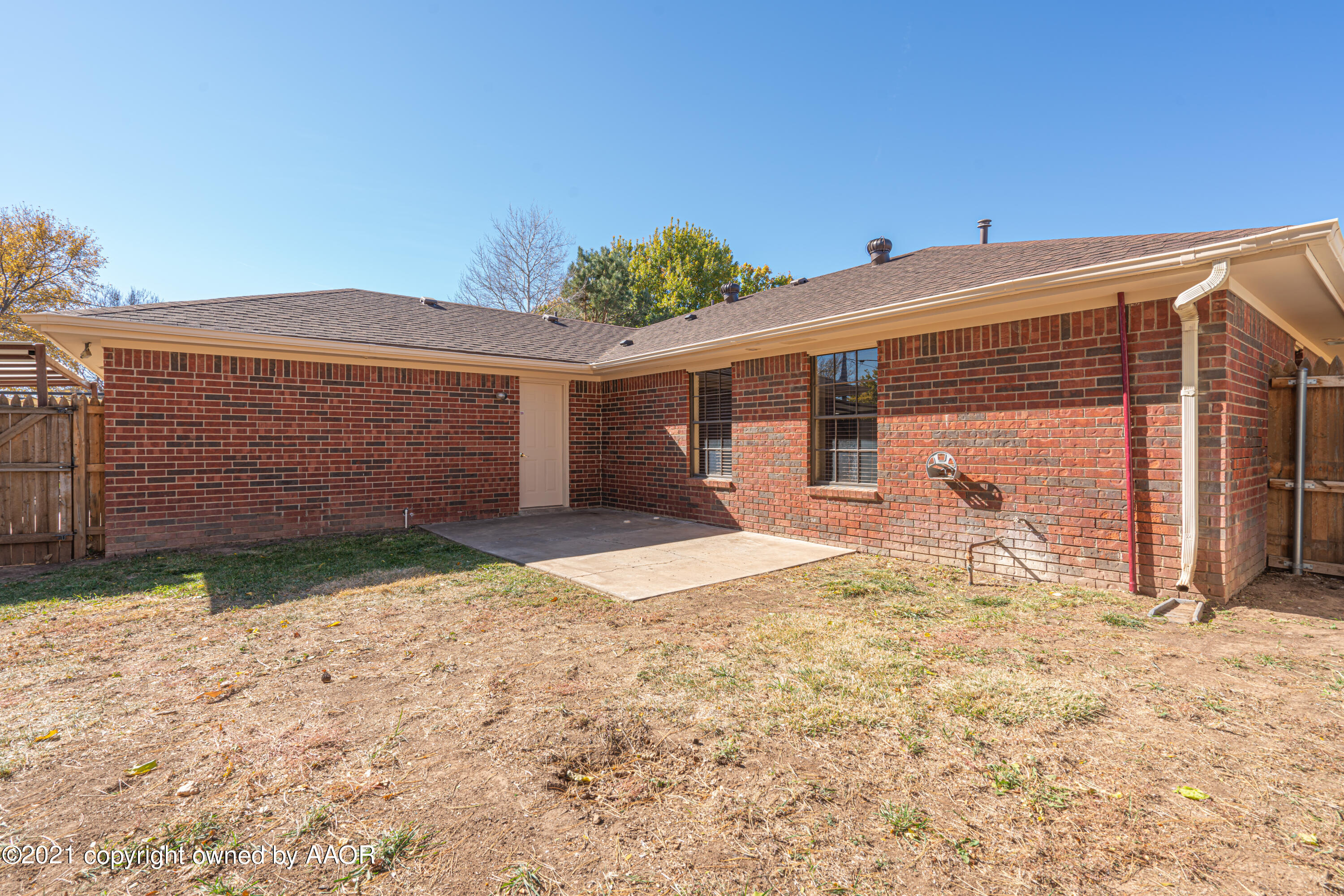 5811 Hardwick Drive Amarillo, TX 79109 - Photo 23 of 24 a front view of a house with a yard and garage