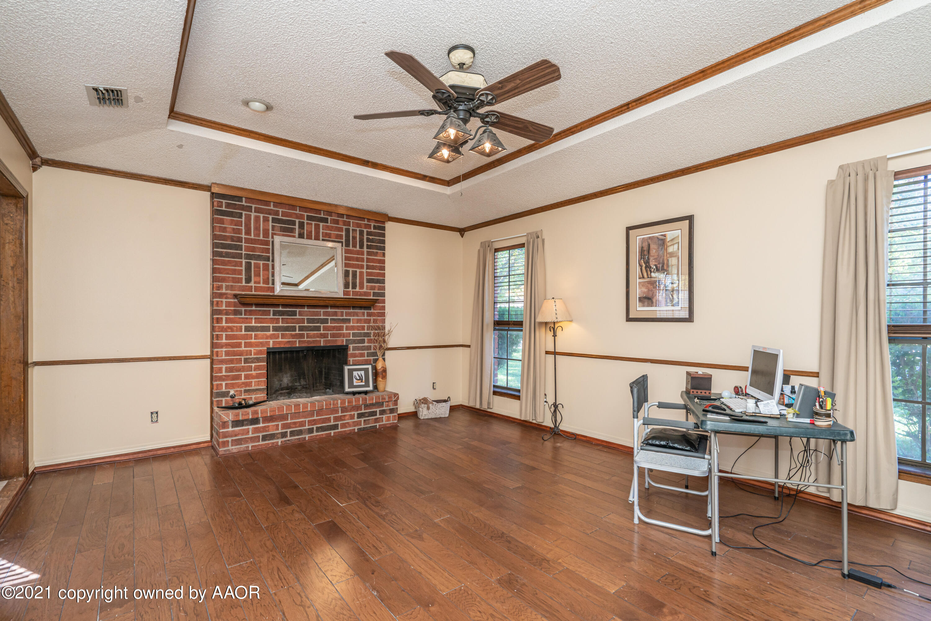 5811 Hardwick Drive Amarillo, TX 79109 - Photo 4 of 24 a living room with fireplace furniture and a wooden floor
