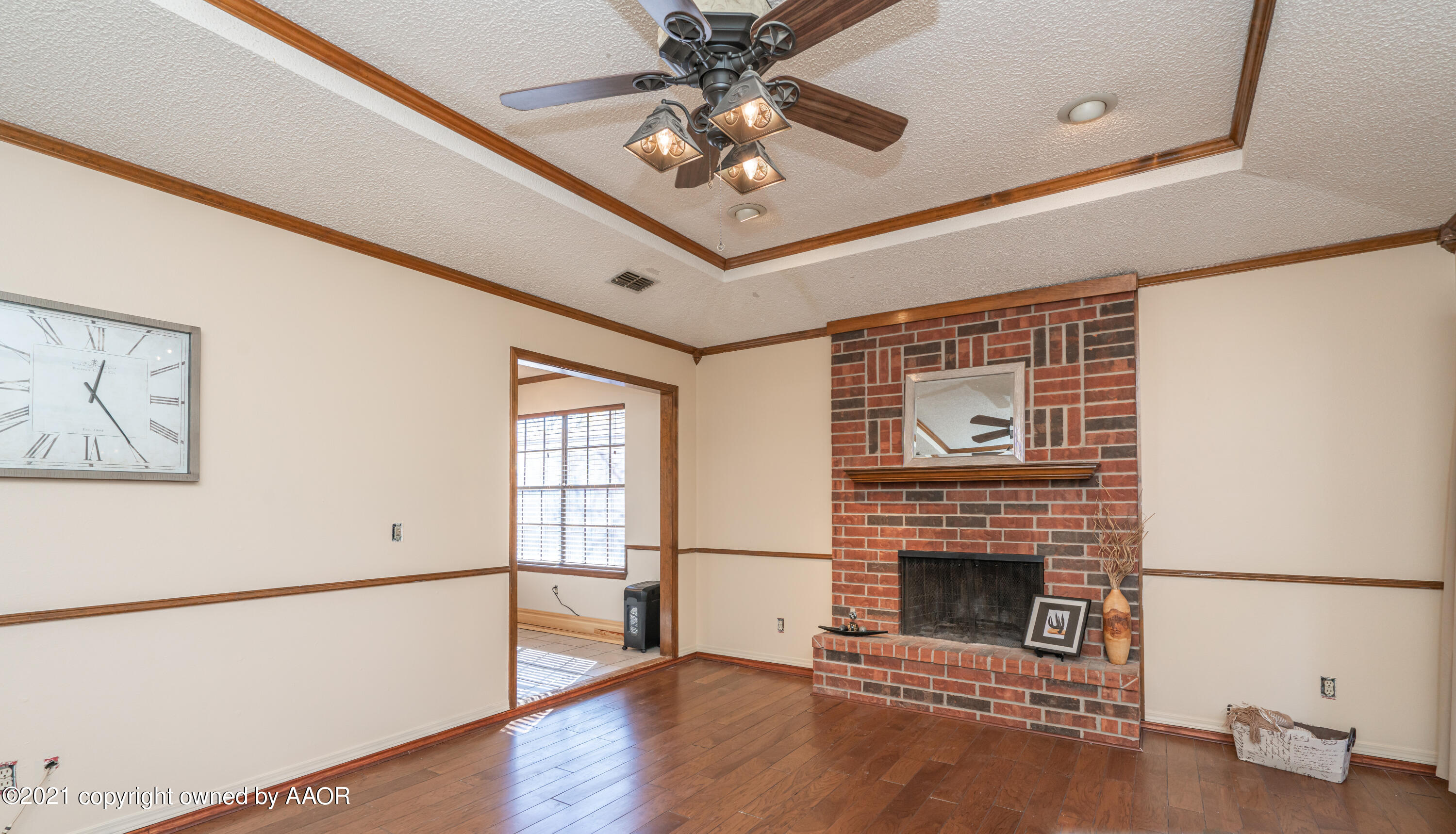 5811 Hardwick Drive Amarillo, TX 79109 - Photo 5 of 24 a living room with stainless steel appliances furniture a fireplace and a window