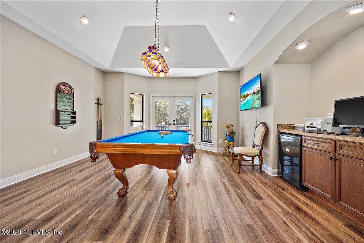 142 Marshall Creek Drive St. Augustine, FL 32095 - Photo 30 of 61 a very nice looking dining room with a table chairs and a kitchen view