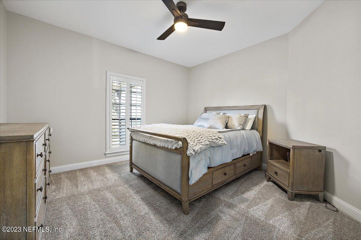 142 Marshall Creek Drive St. Augustine, FL 32095 - Photo 32 of 61 a bedroom with a bed and window