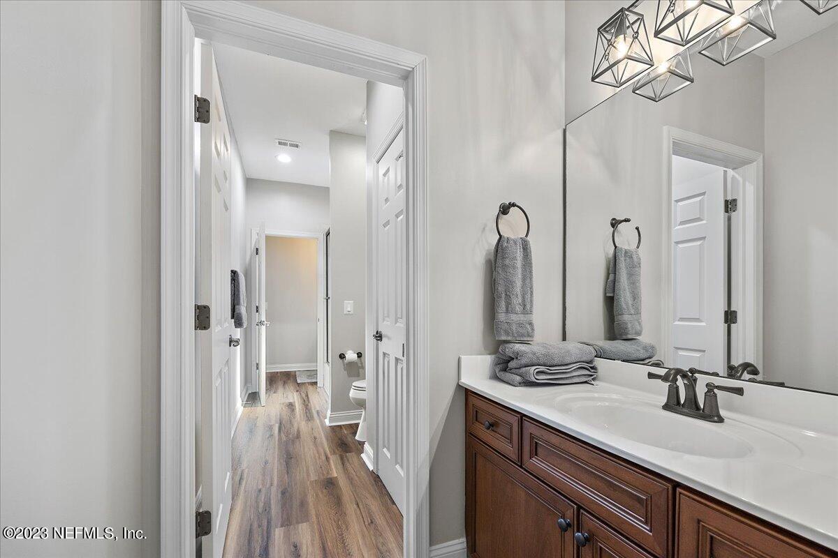 142 Marshall Creek Drive St. Augustine, FL 32095 - Photo 35 of 61 a bathroom with a double vanity sink and a mirror