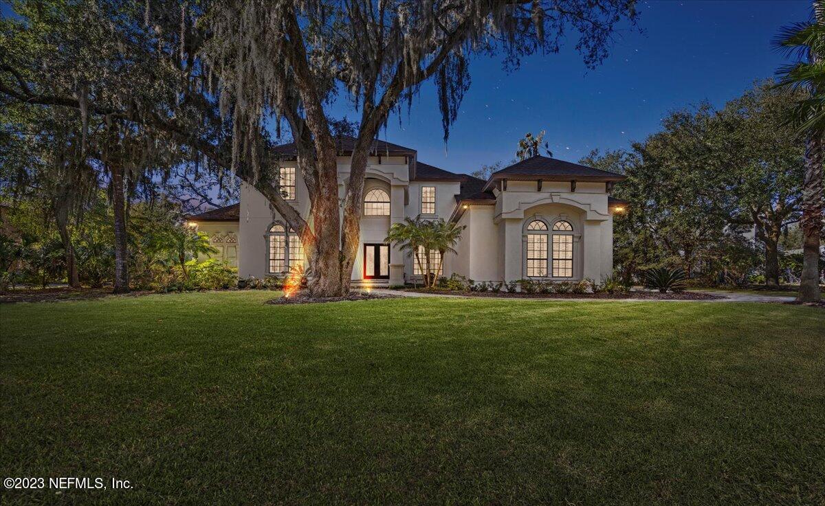 142 Marshall Creek Drive St. Augustine, FL 32095 - Photo 48 of 61 a front view of a house with a garden