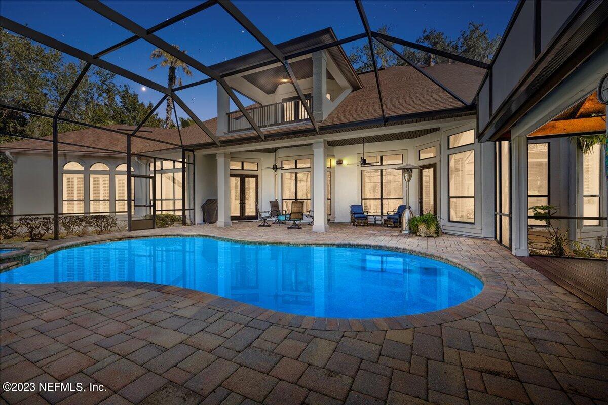 142 Marshall Creek Drive St. Augustine, FL 32095 - Photo 51 of 61 a view of a swimming pool with a porch