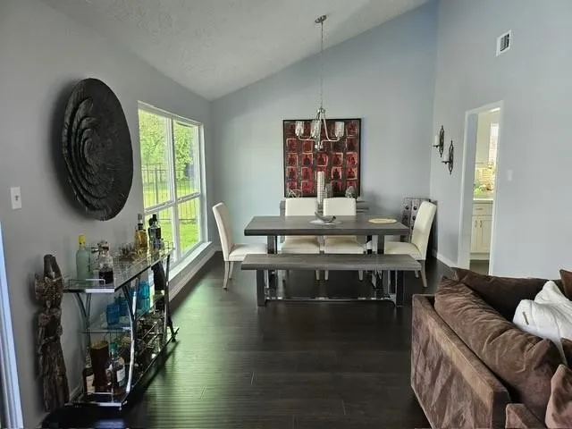 a view of a livingroom with furniture and a large window