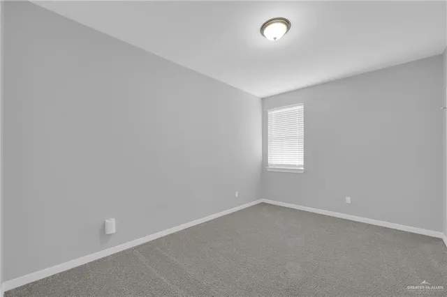 an empty room with a empty space and window