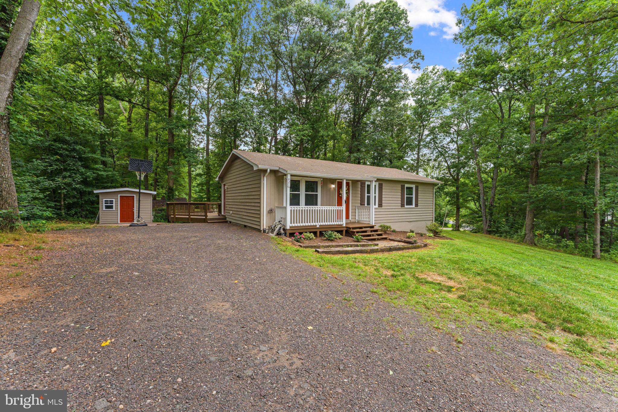 1821 James City Road Reva, VA 22735 - Photo 4 of 44 front view of a house with a big yard