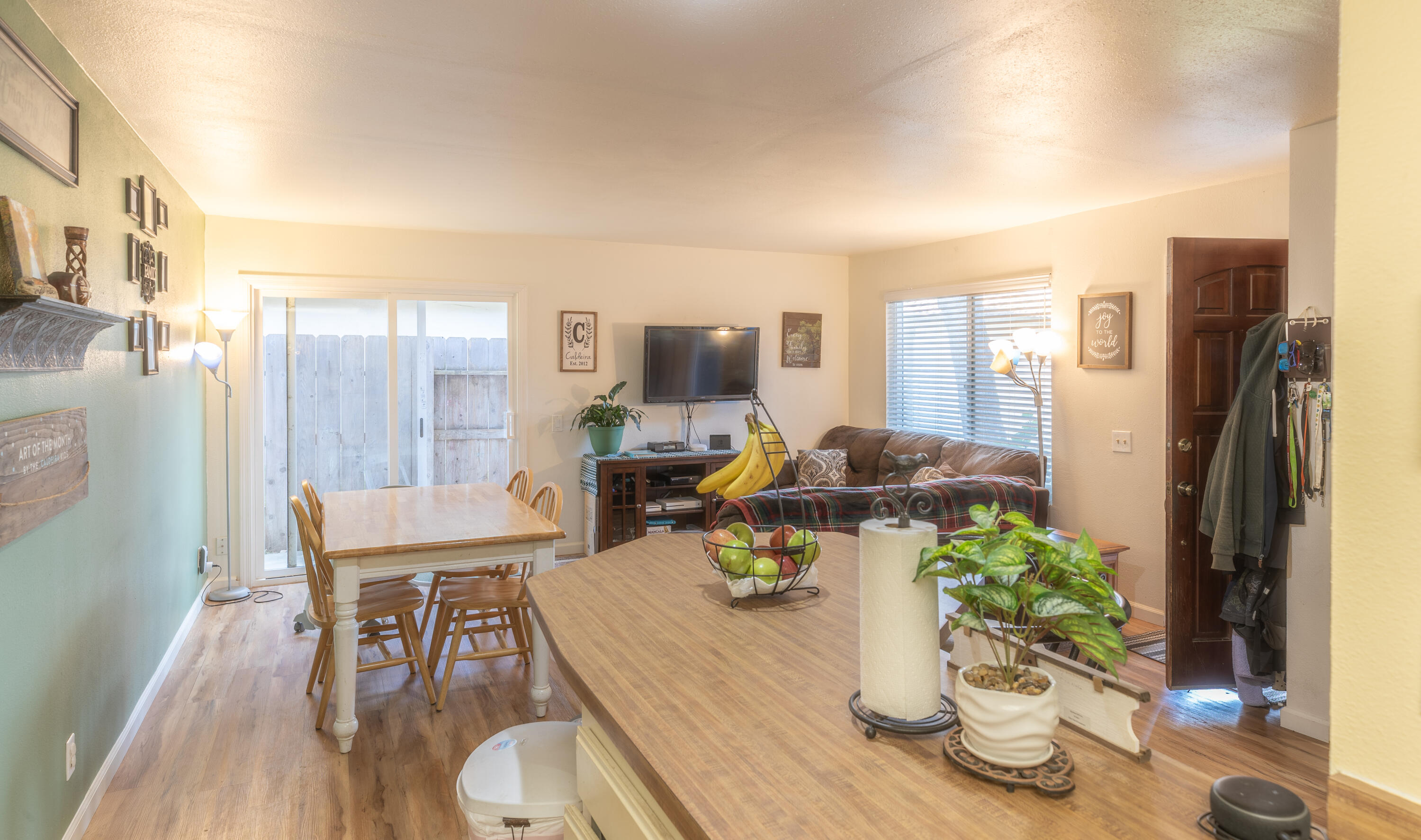920 North M Place Lompoc, CA 93436 - Photo 11 of 25 a view of a dining room with furniture a potted plant and wooden floor