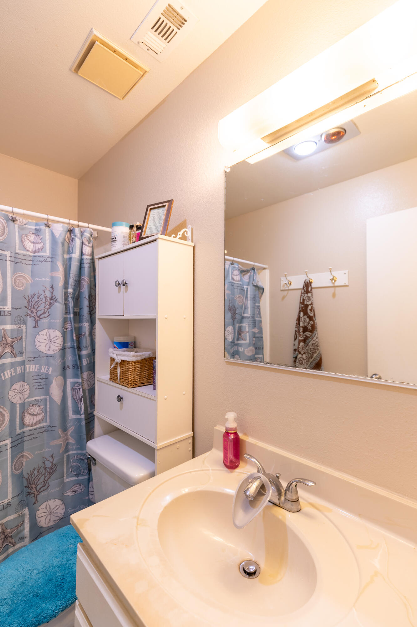 920 North M Place Lompoc, CA 93436 - Photo 14 of 25 a bathroom with a sink and a mirror
