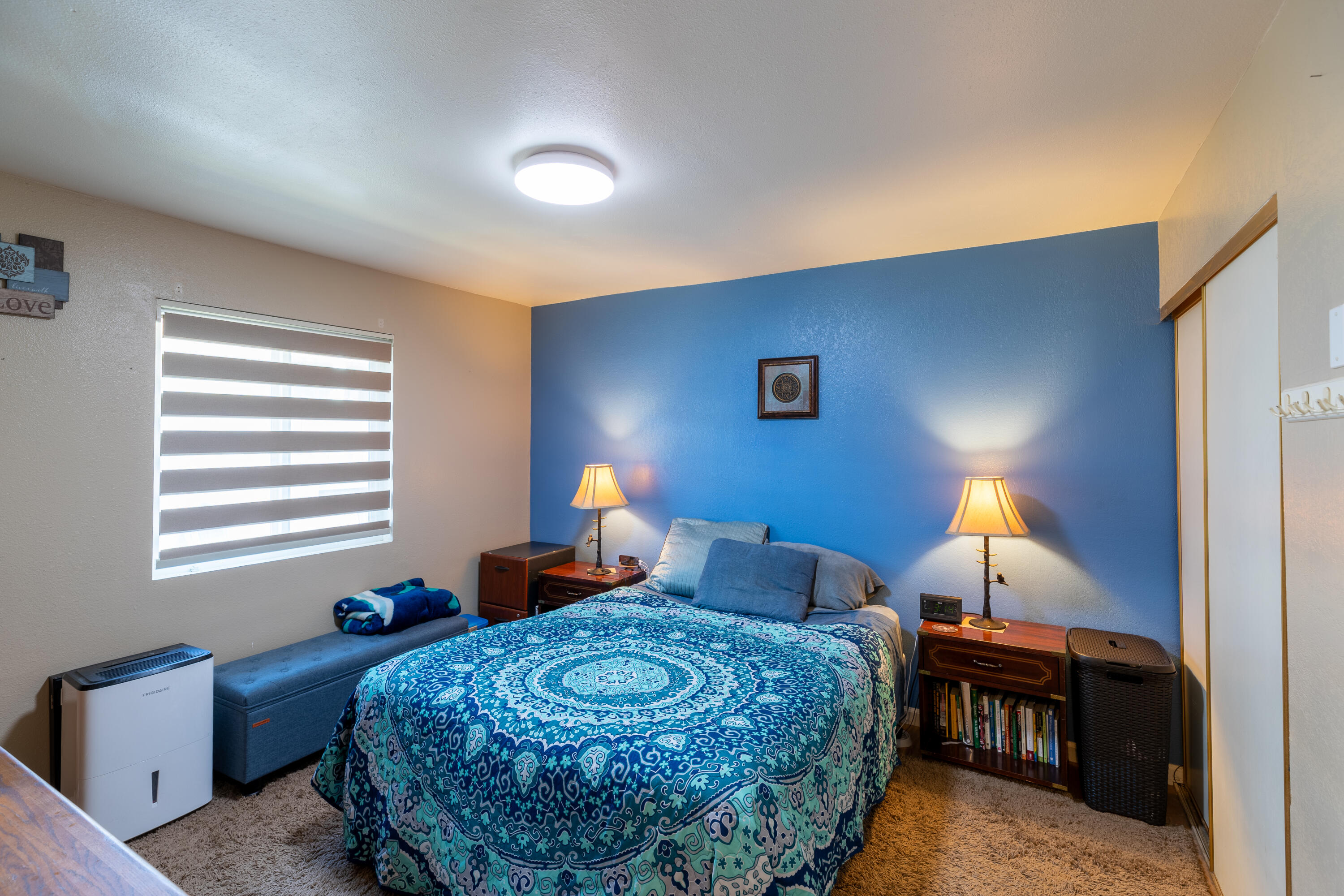 920 North M Place Lompoc, CA 93436 - Photo 17 of 25 a bedroom with a bed and a lamp with window