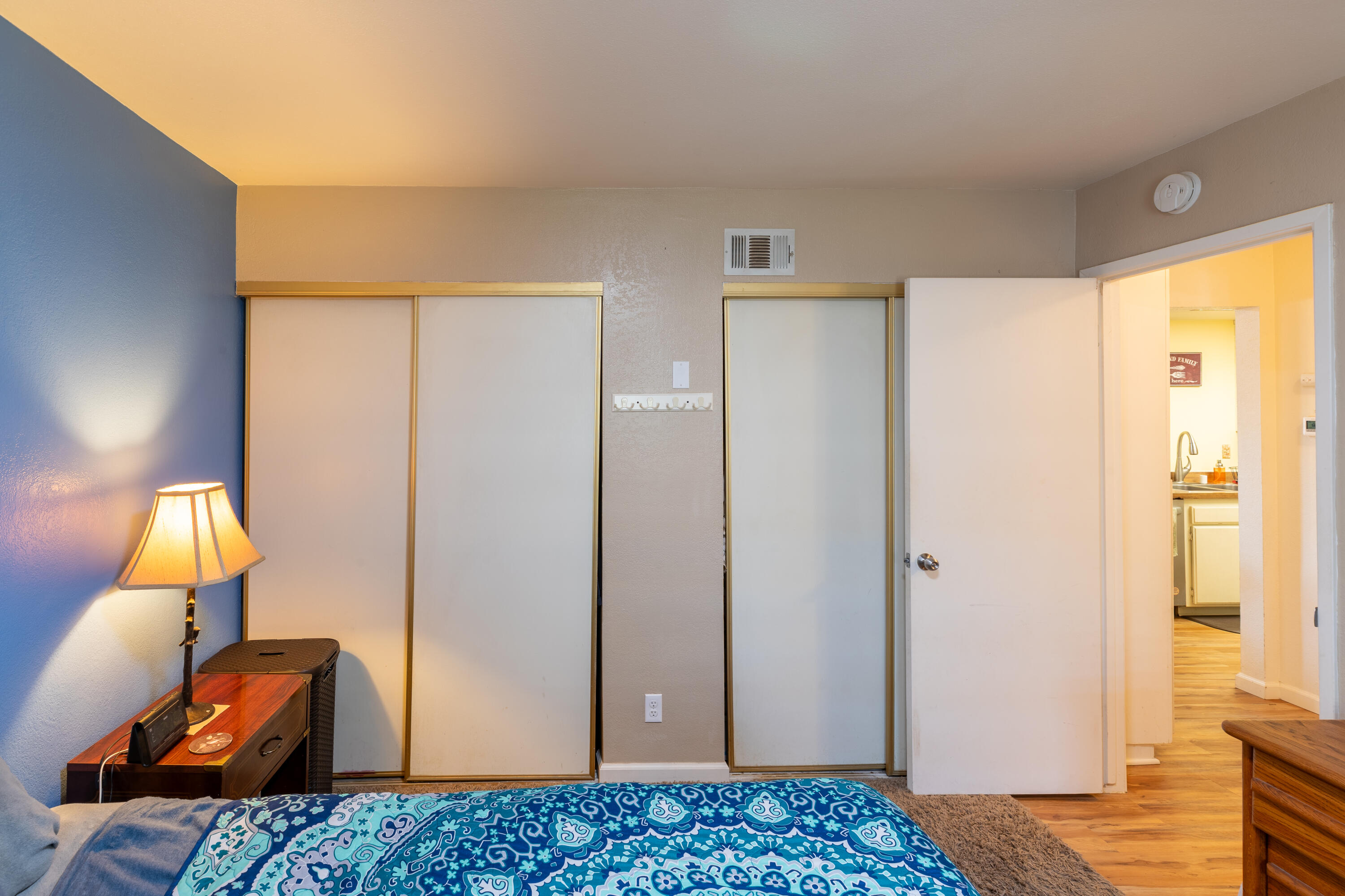 920 North M Place Lompoc, CA 93436 - Photo 19 of 25 a bedroom with a bed and wooden floor