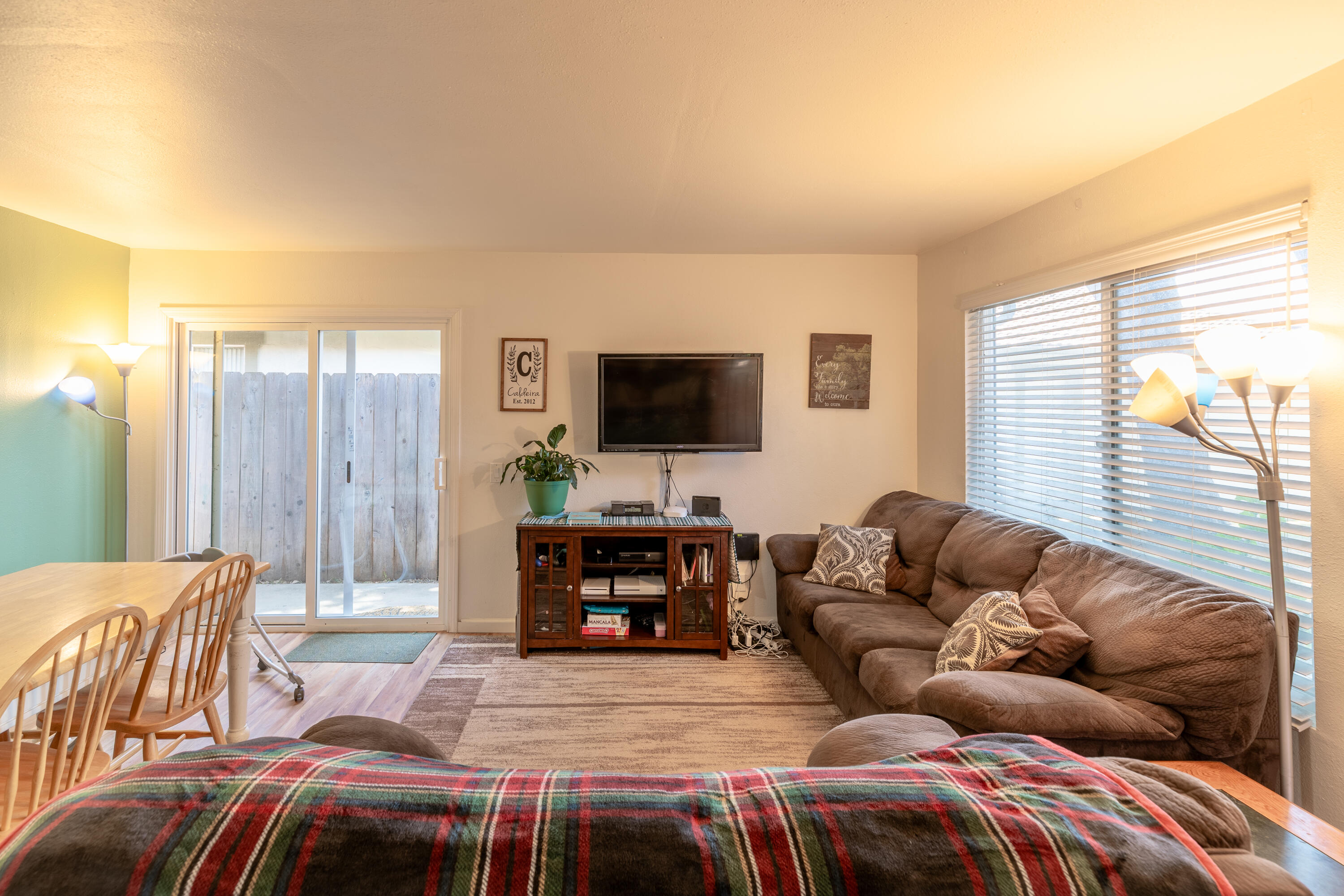 920 North M Place Lompoc, CA 93436 - Photo 7 of 25 a living room with a couch and a flat screen tv