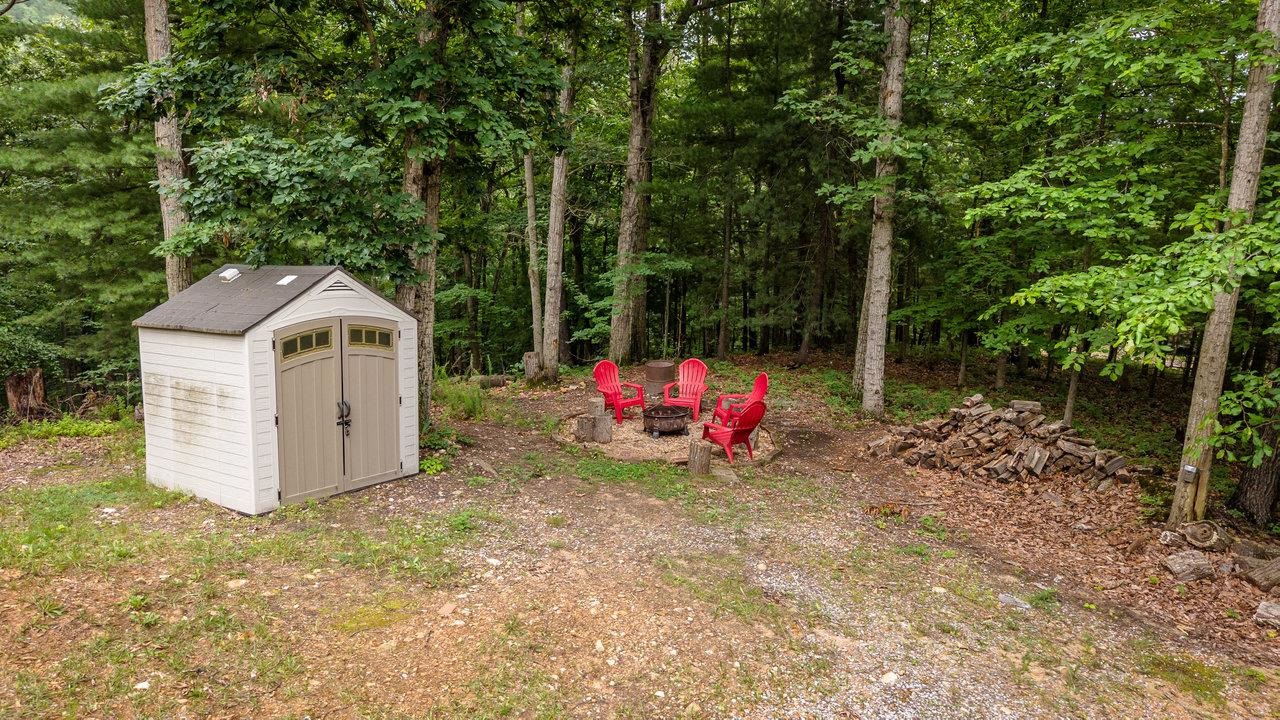 159 Park View Shenandoah, VA 22849 - Photo 67 of 70 a view of a wooden house with a small yard and large trees