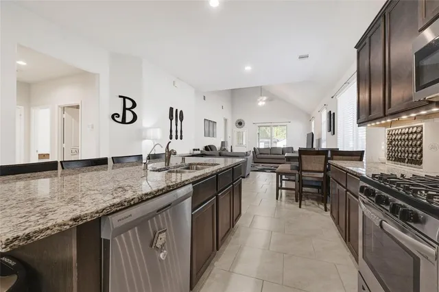 a kitchen with a dining table and chairs