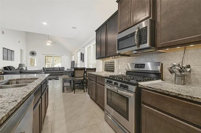 a kitchen with a sink and refrigerator