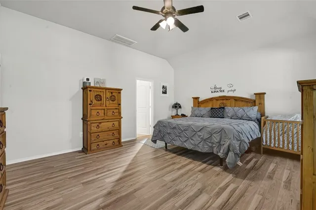 a white bath tub sitting next to a shower