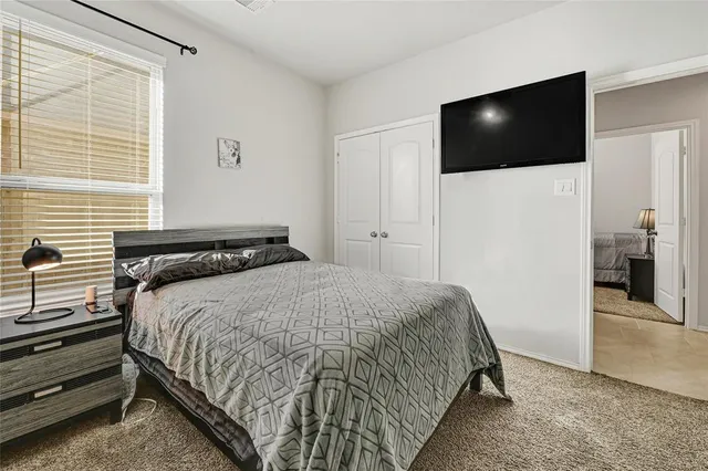 a view of a room with furniture and a large window