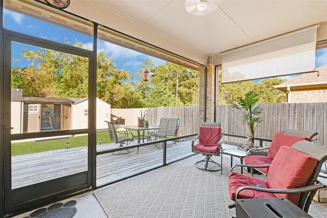 an aerial view of residential houses with outdoor space and lake view