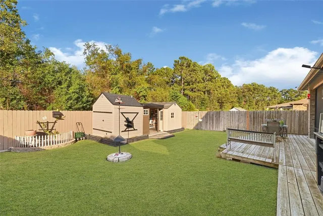 an aerial view of a swimming pool with outdoor seating