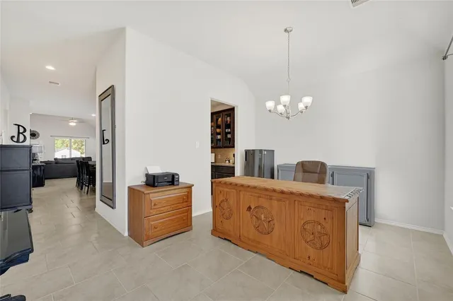 a bedroom with a bed and a table