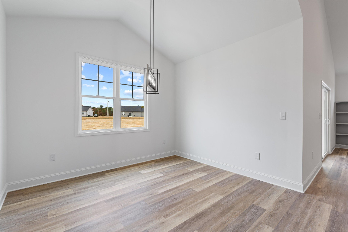 4000 Origin Drive Bailey, NC 27807 - Photo 14 of 47 a view of an empty room with wooden floor and a window