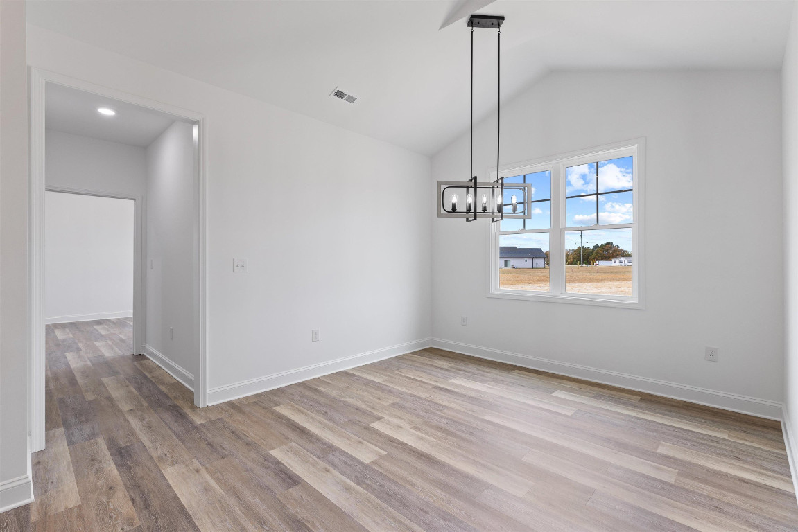 4000 Origin Drive Bailey, NC 27807 - Photo 15 of 47 a view of a room with wooden floor closet and windows