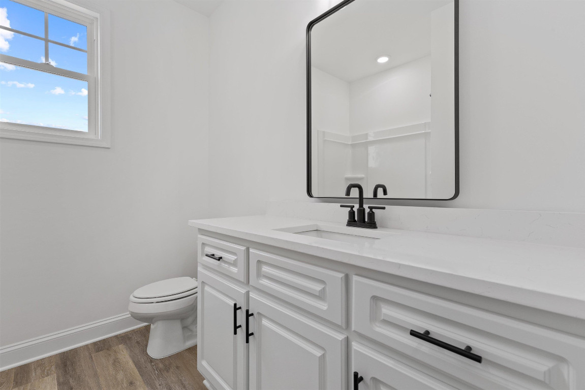 4000 Origin Drive Bailey, NC 27807 - Photo 20 of 47 a bathroom with a toilet a sink and mirror