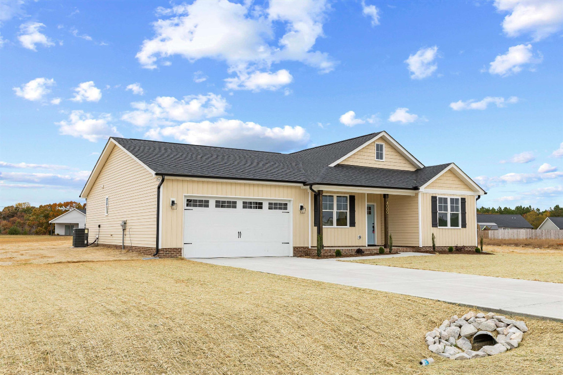 4000 Origin Drive Bailey, NC 27807 - Photo 2 of 47 a front view of a house with a yard
