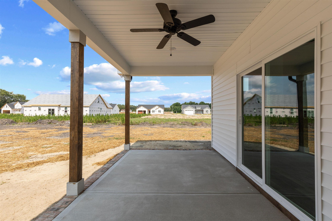 4000 Origin Drive Bailey, NC 27807 - Photo 41 of 47 a view of a living room and chandelier fan floor to ceiling window with a ceiling fan