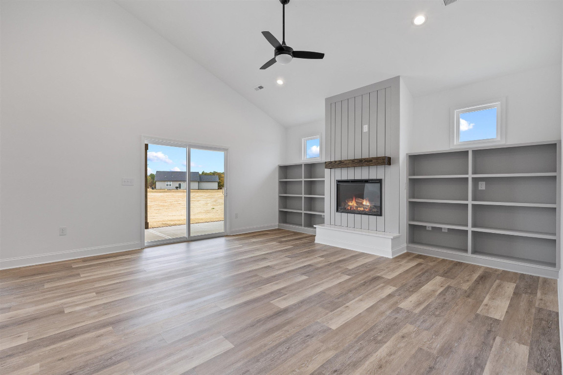 4000 Origin Drive Bailey, NC 27807 - Photo 7 of 47 a view of an empty room with a fireplace and a window