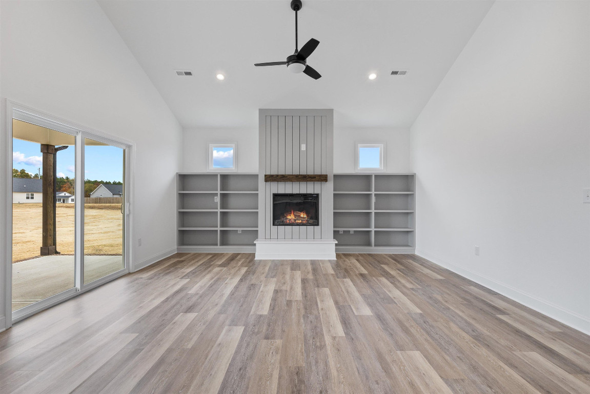 4000 Origin Drive Bailey, NC 27807 - Photo 8 of 47 a view of empty room with wooden floor and fireplace