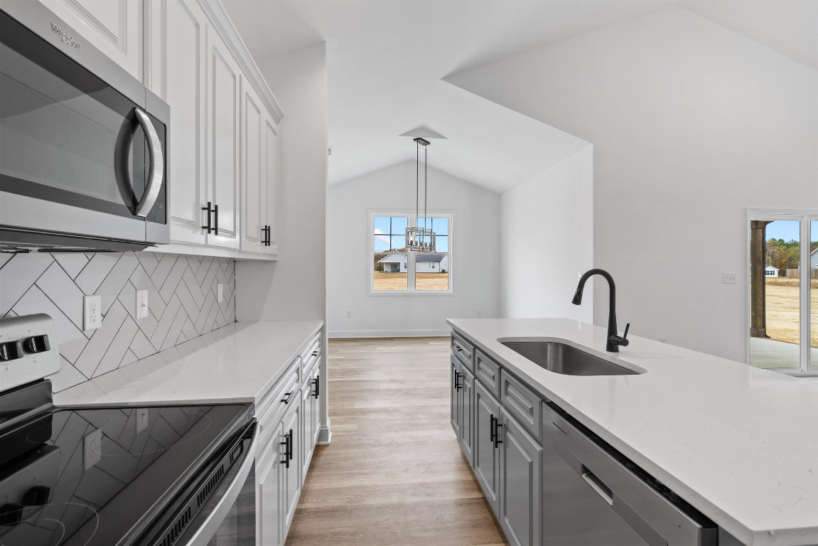 4000 Origin Drive Bailey, NC 27807 - Photo 10 of 47 a kitchen with stainless steel appliances granite countertop a sink and a microwave