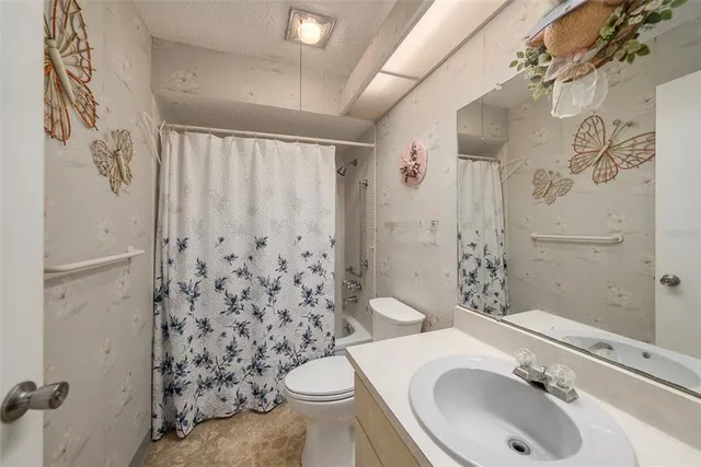 a room with a window and a ceiling fan