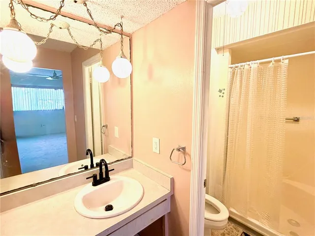 a group of people sitting in front of a house