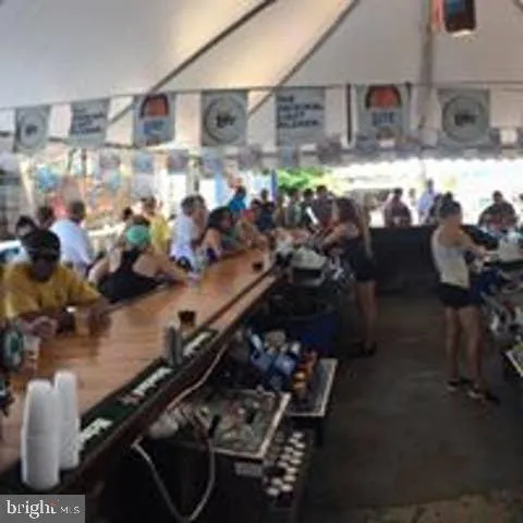 a view of a dining room with furniture and window