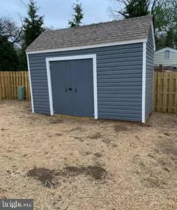 a bedroom with a bed and a television