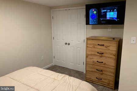 6145 5th Street King George, VA 22485 - Photo 24 of 29 a bedroom with a bed and a television