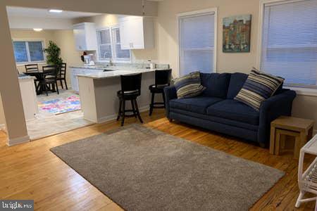 6145 5th Street King George, VA 22485 - Photo 6 of 29 a living room with furniture a rug and kitchen view