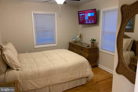 6145 5th Street King George, VA 22485 - Photo 8 of 29 a bedroom with a bed and wooden floor