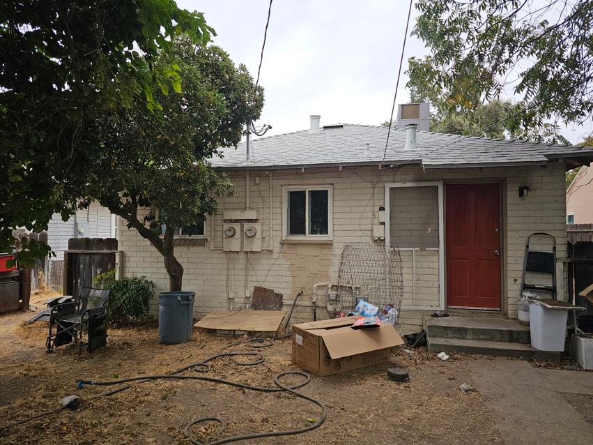 114 North J Street Madera, CA 93637 - Photo 14 of 20 a view of a patio with table and chairs and potted plants