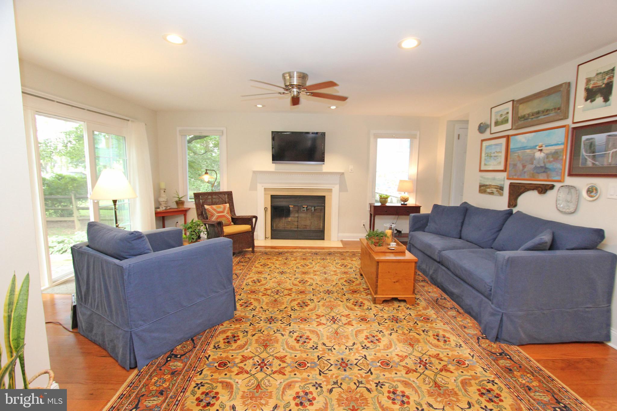 951 Conestoga Road Berwyn, PA 19312 - Photo 12 of 41 a living room with furniture a flat screen tv and a fireplace