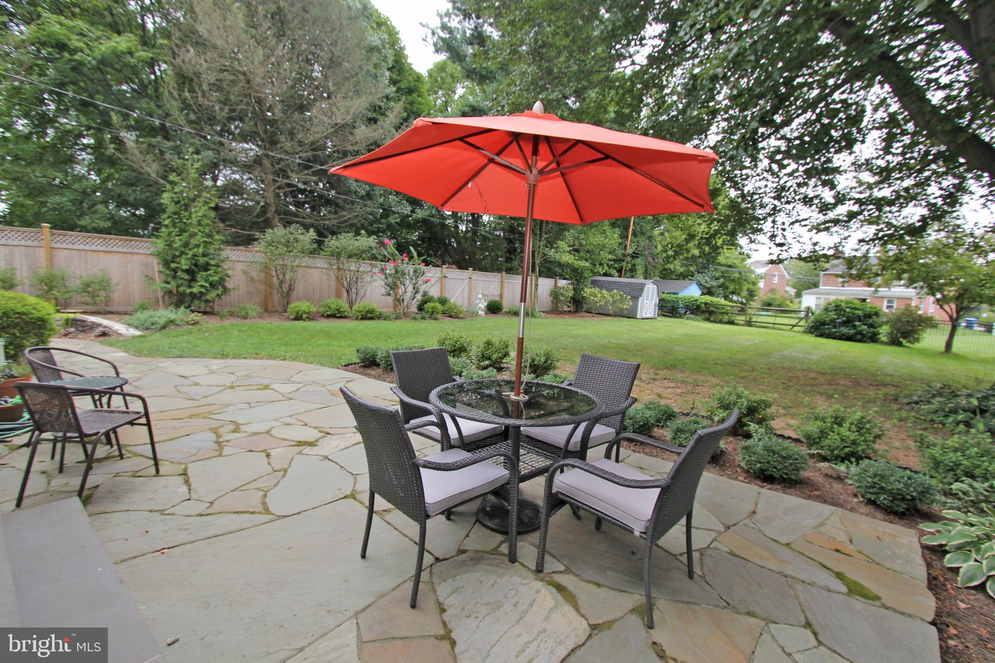951 Conestoga Road Berwyn, PA 19312 - Photo 16 of 41 a view of patio with chairs and table under an umbrella