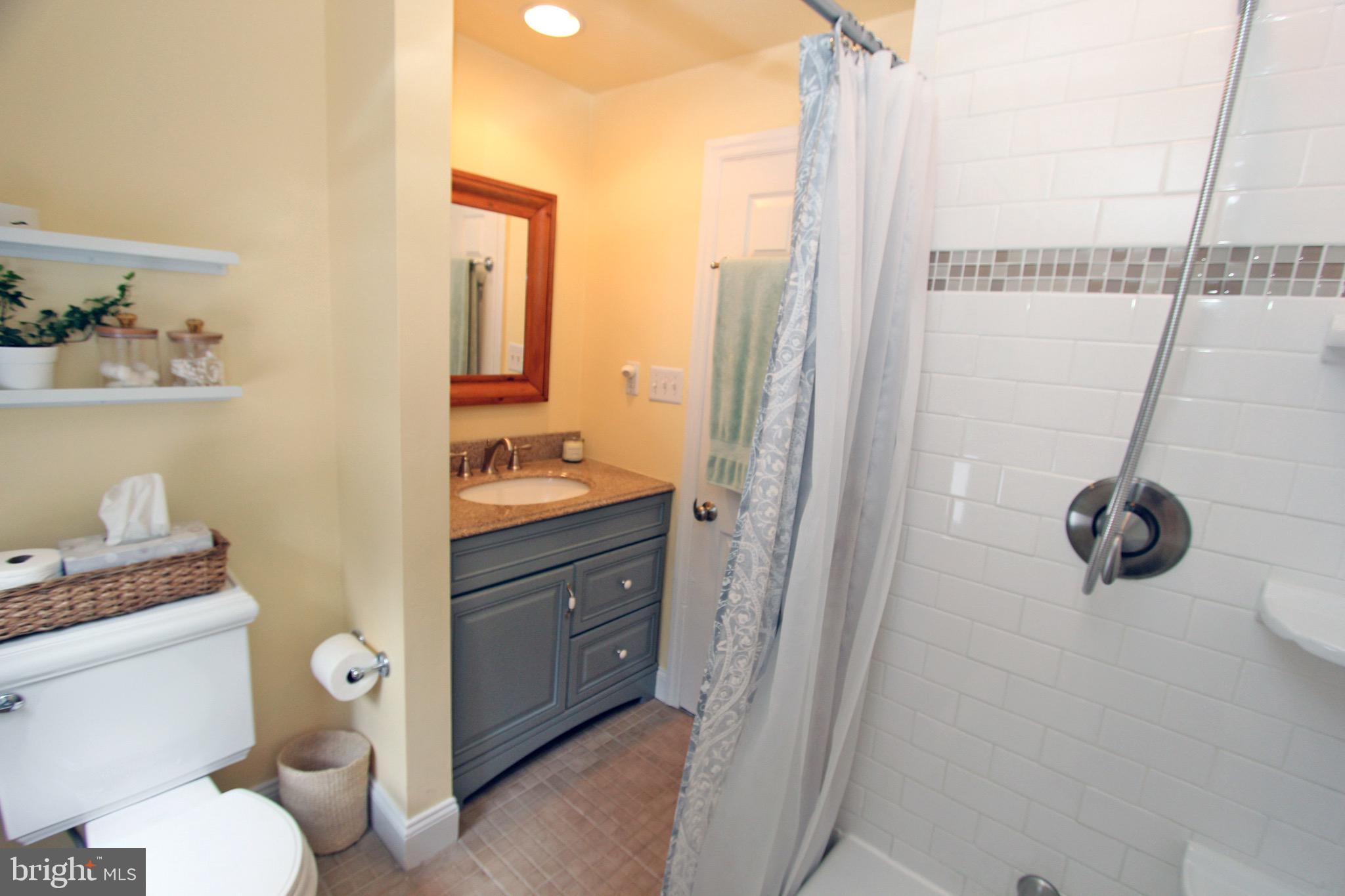 951 Conestoga Road Berwyn, PA 19312 - Photo 26 of 41 a bathroom with a granite countertop sink toilet and shower