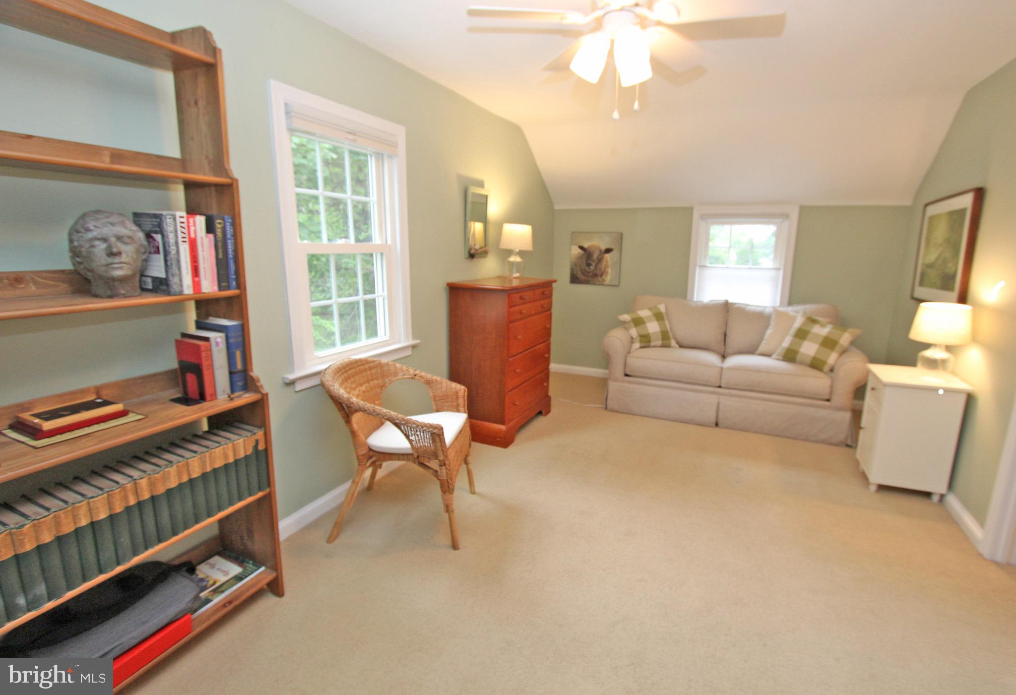 951 Conestoga Road Berwyn, PA 19312 - Photo 28 of 41 a living room with furniture a chandelier and a window
