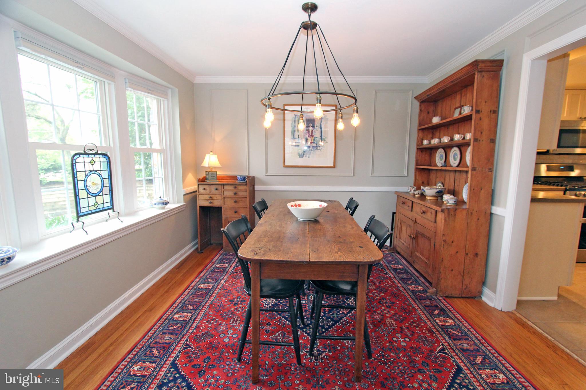 951 Conestoga Road Berwyn, PA 19312 - Photo 5 of 41 a dining room with furniture a rug and wooden floor
