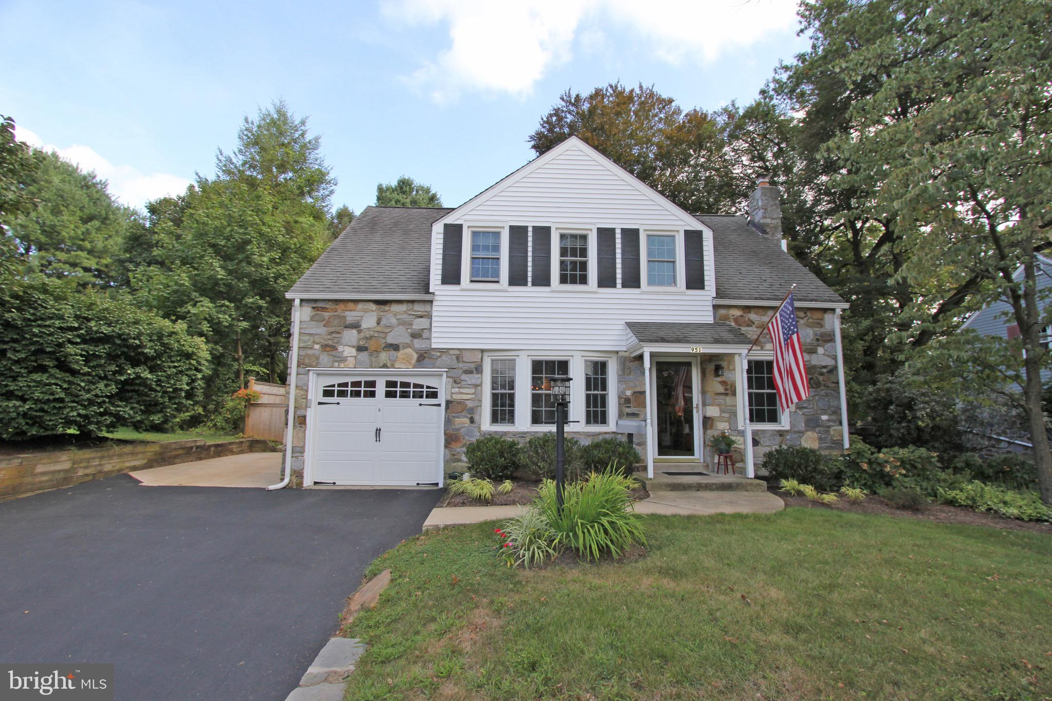 951 Conestoga Road Berwyn, PA 19312 - Photo 41 of 41 a front view of a house with a yard and trees