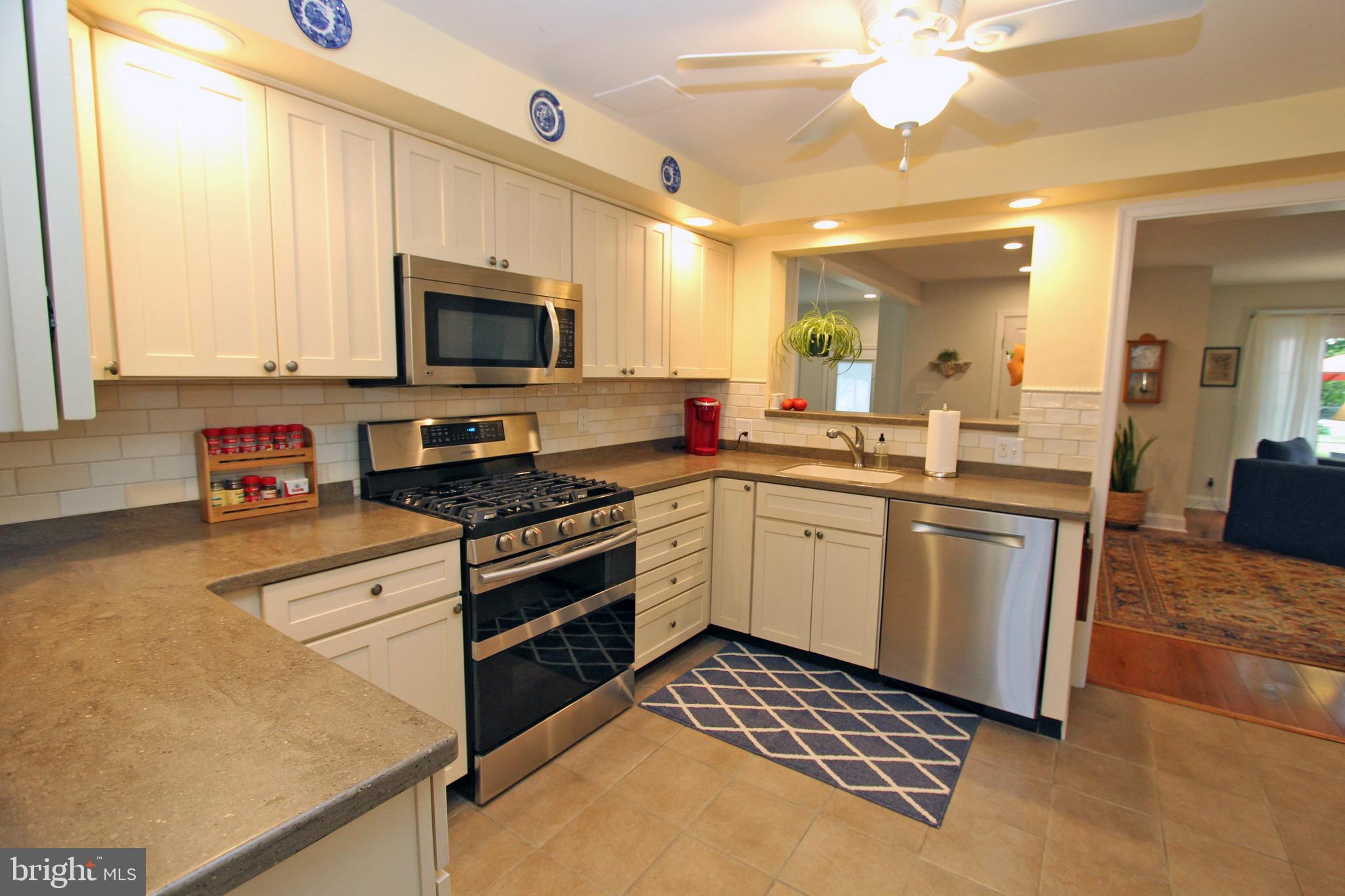 951 Conestoga Road Berwyn, PA 19312 - Photo 8 of 41 a kitchen with a sink stove and microwave