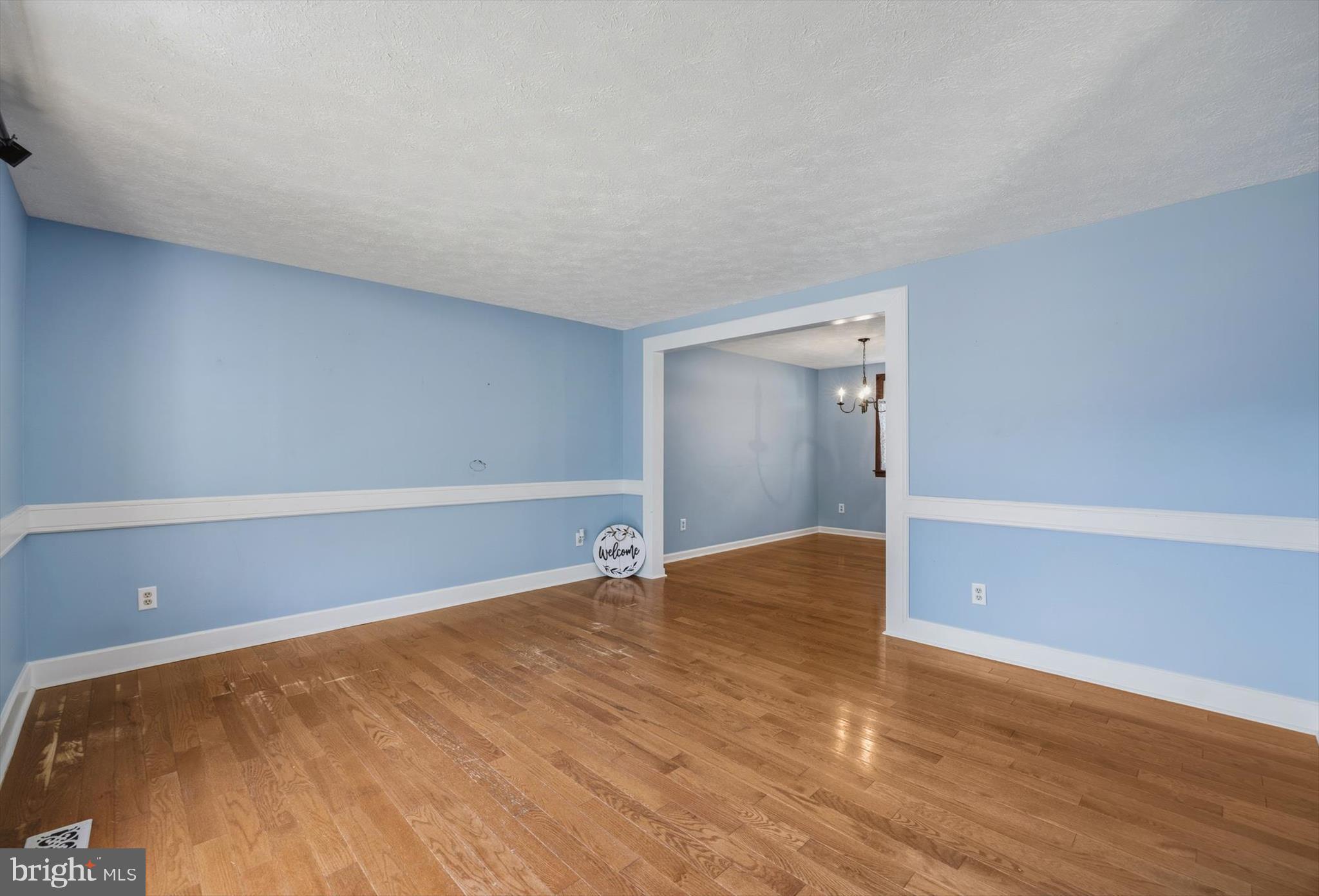 1506 Gollum Road Hanover, MD 21076 - Photo 6 of 44 a view of an empty room and wooden floor