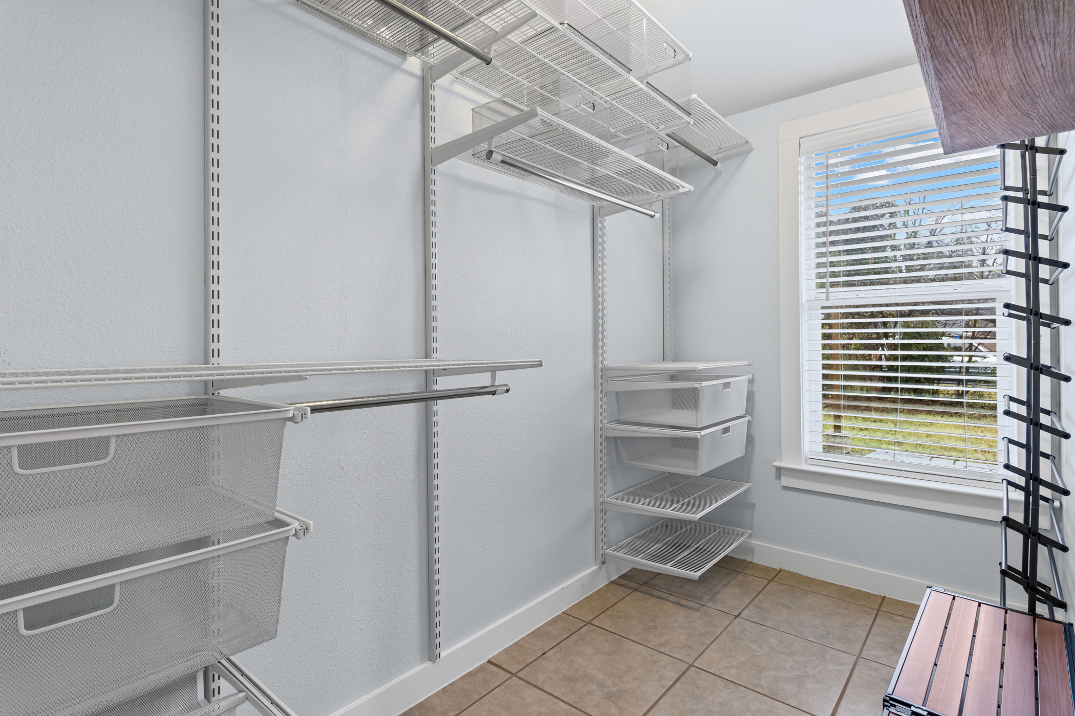84 Waller Street Austin, TX 78702 - Photo 17 of 22 Spacious closet featuring light tile patterned flooring