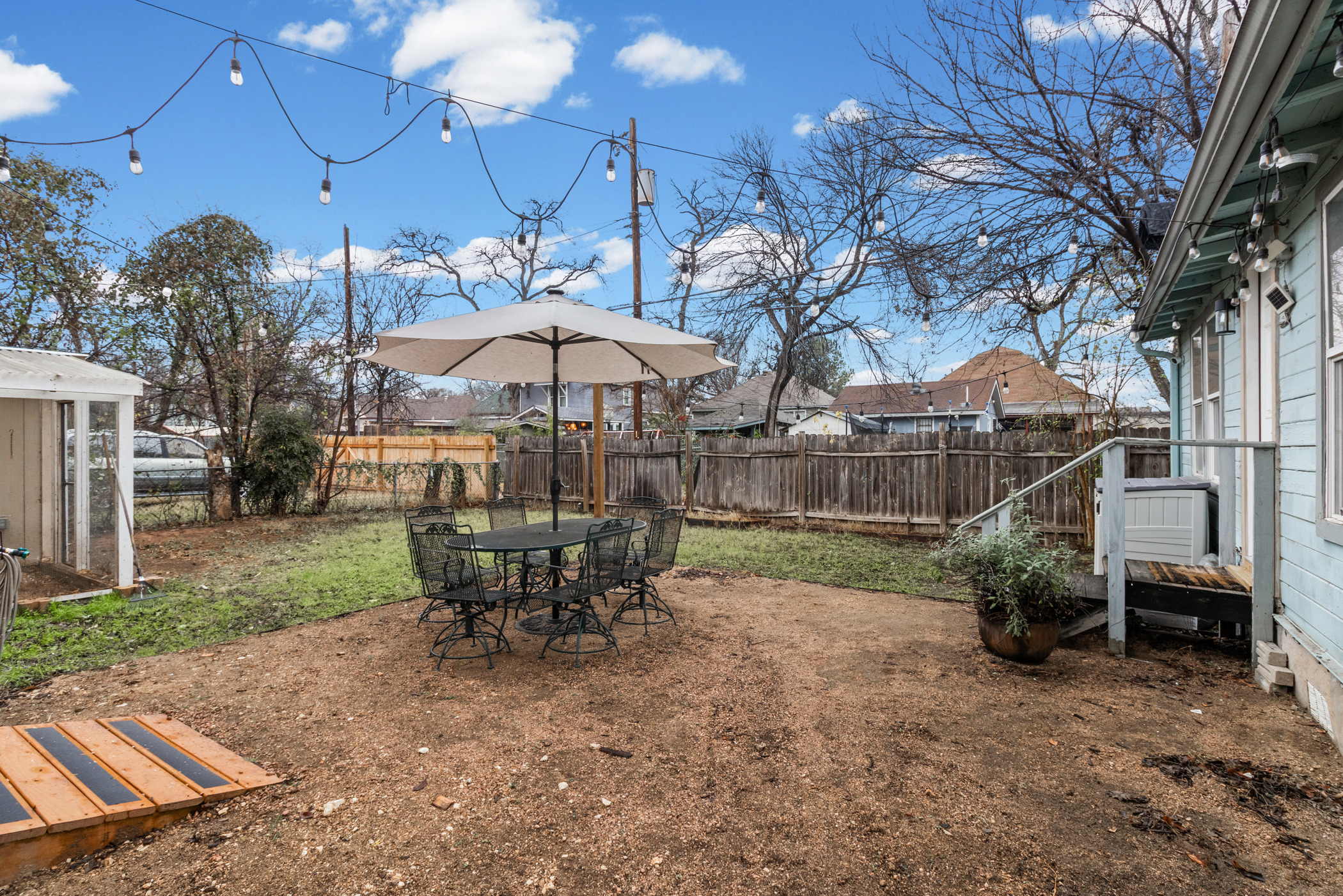 84 Waller Street Austin, TX 78702 - Photo 20 of 22 Fenced backyard featuring outdoor dining area